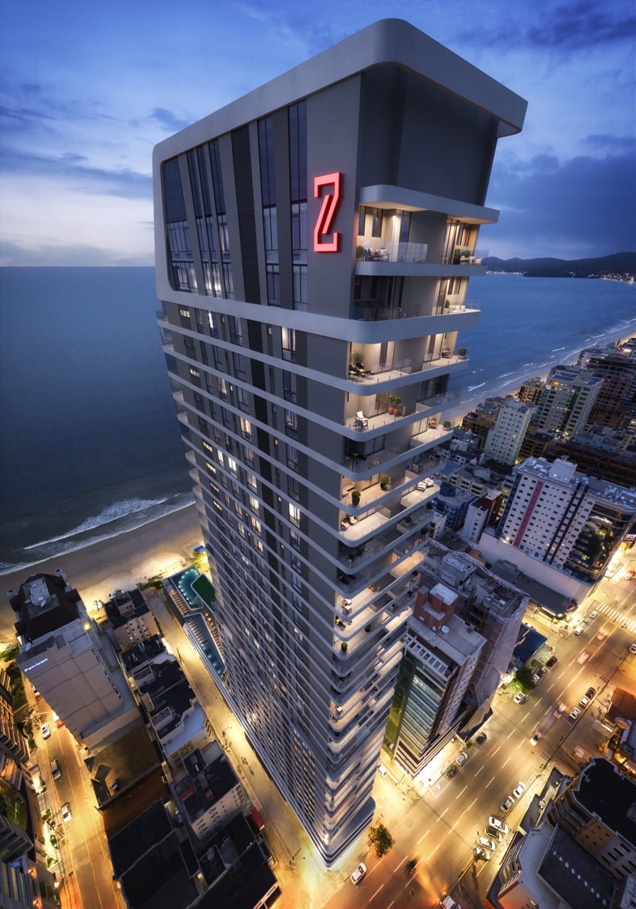 Fachada da torre Legend Vila Rica ao entardecer, vista de cima, à beira-mar em Meia Praia